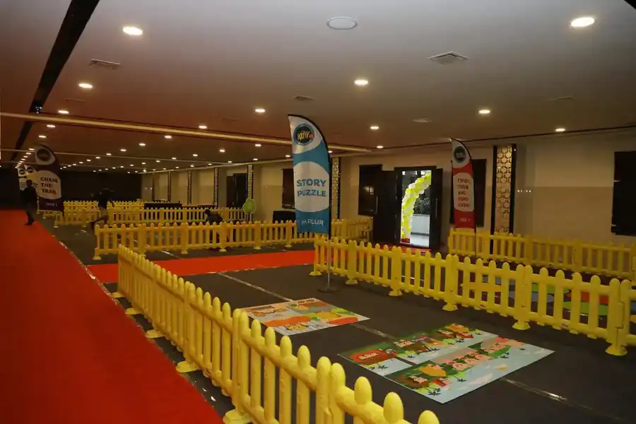 Indoor activity arena with yellow fencing